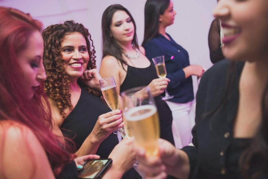 Image of women drinking and having a good time at a corporate event for their copmany