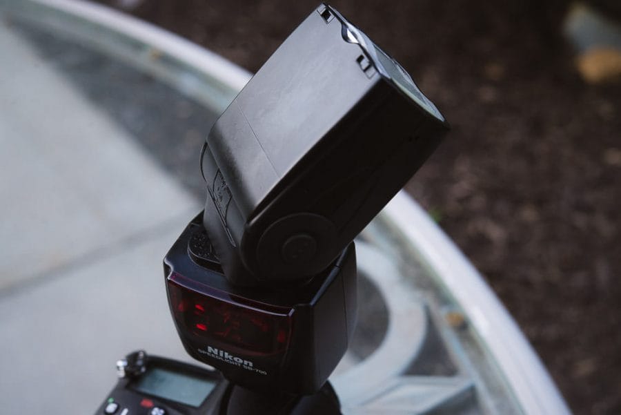 Image of a Nikon SB 700 flash with its flash head pointed up and angled for bouncing light