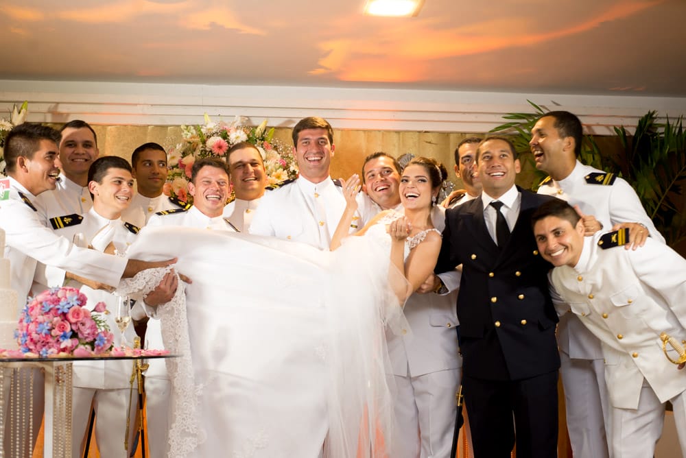 Picture of groomsmen at a brazilian wedding holding up bride
