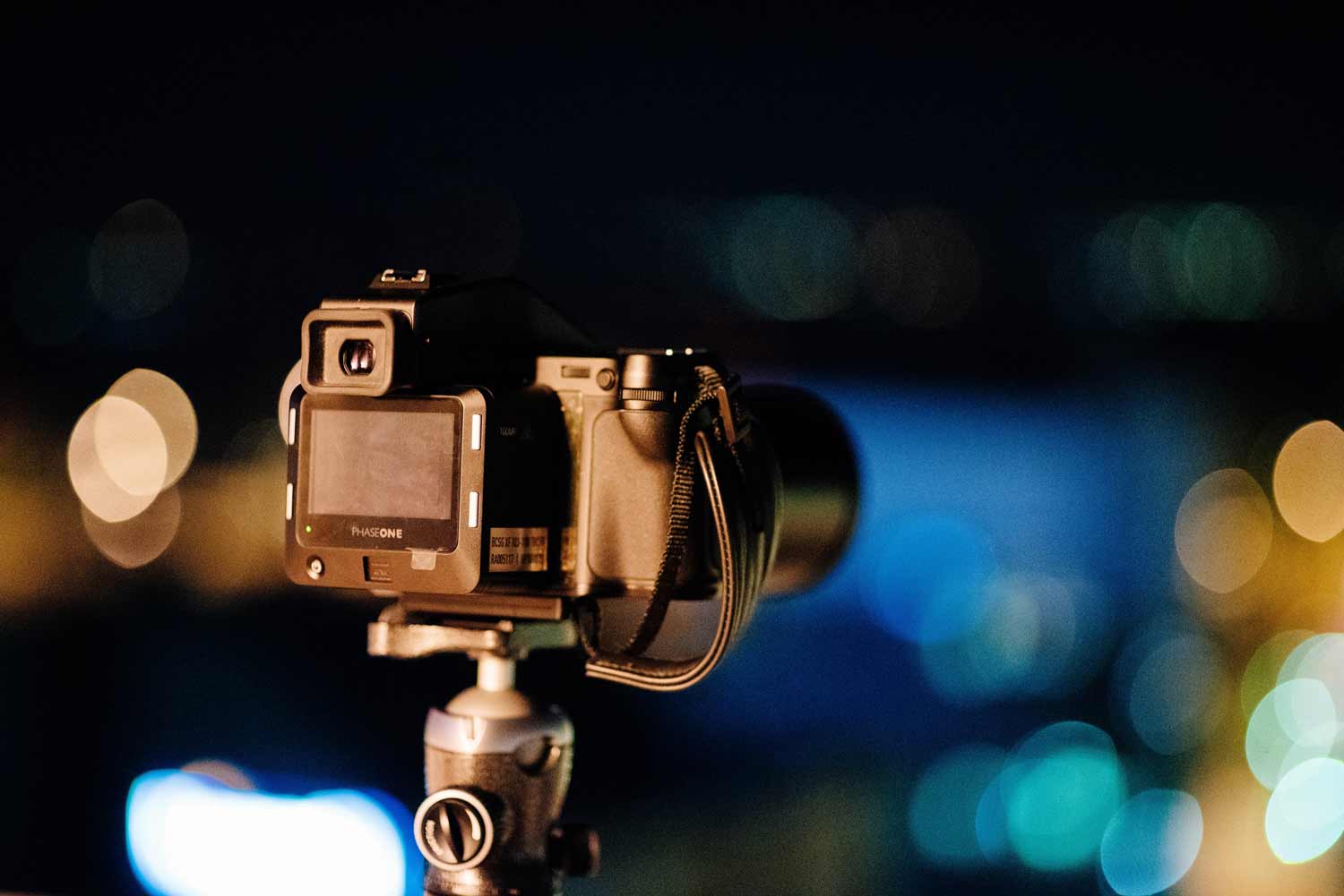 Image of a camera set up on a tripod for event photography