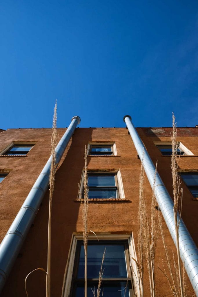Vertical image of brown building and deep blue sky