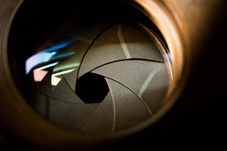 Image of a gray aperture opening on a camera lens.