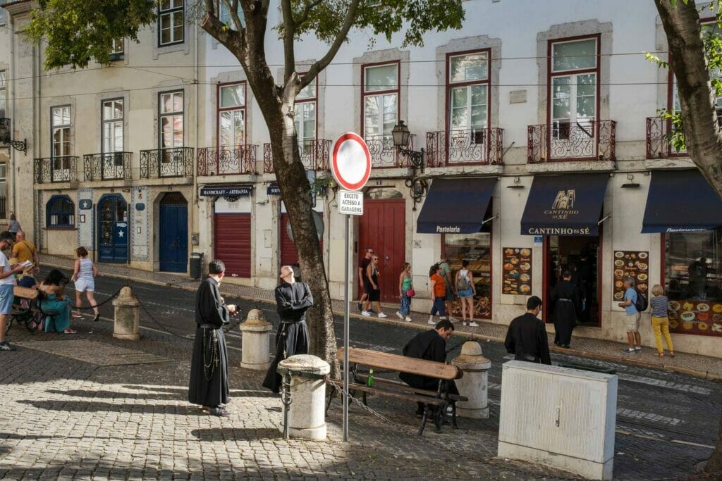Priests talking on the street in Lisbon, Portugal