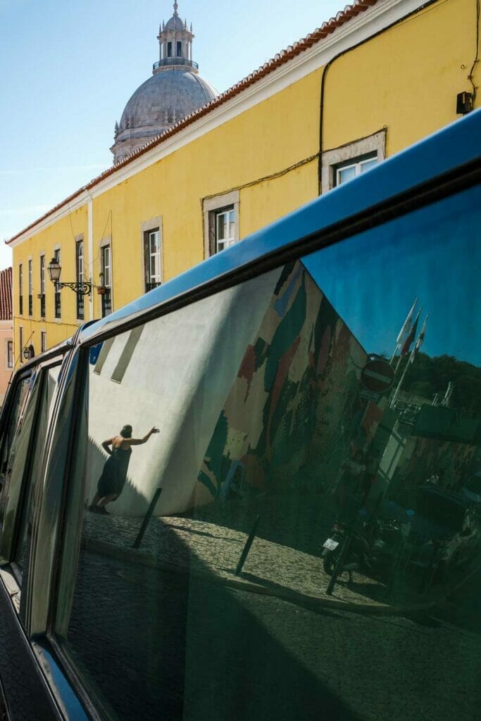 Woman on a narrow street in a reflection